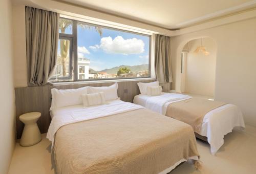 Postel nebo postele na pokoji v ubytování Shenzhen Semporna Beach Sea View B & B - 深圳较场尾仙本那沙滩海景民宿