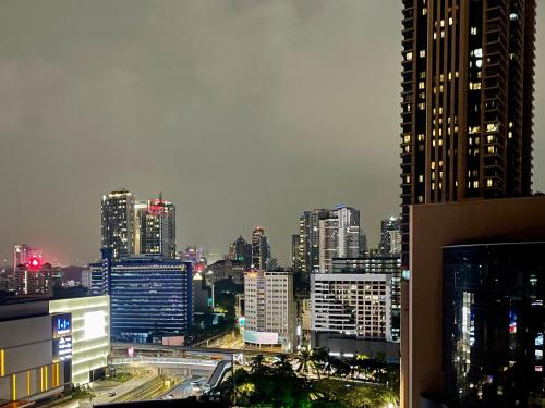 a view of a city skyline at night at Comfy-Concept Apartment @ B.Bintang (3min walk LRT, Lalaport, TimeSquare) in Kuala Lumpur