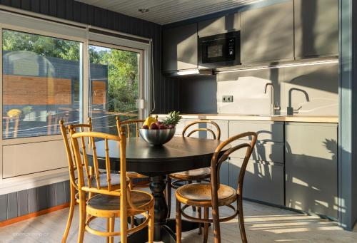 a kitchen with a table and chairs and a window at Houseboat - best place in Prague in Prague