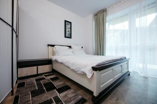 En eller flere senge i et værelse på L&V Family Studio