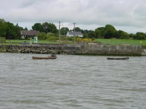 two boats sitting in a body of water at Presentation Convent in Mooncoin