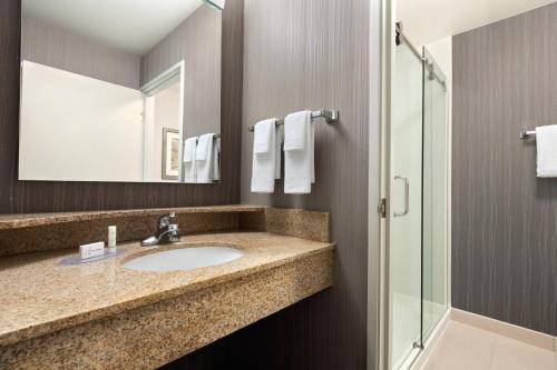 a bathroom with a sink and a shower at Courtyard By Marriott Salinas Monterey in Salinas