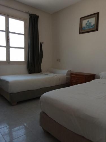 Ένα ή περισσότερα κρεβάτια σε δωμάτιο στο camping-car sahara line boujdour