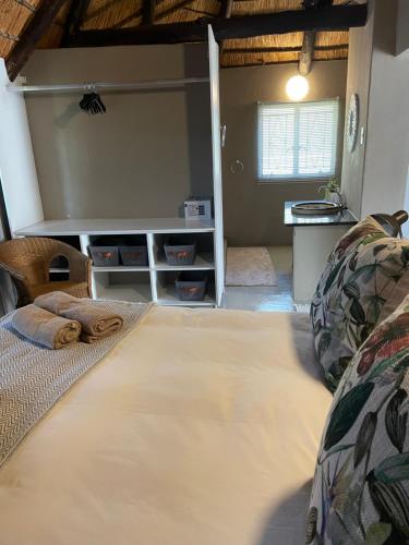 a bedroom with a large bed in a room at Jock of the Bushveld in Barberton