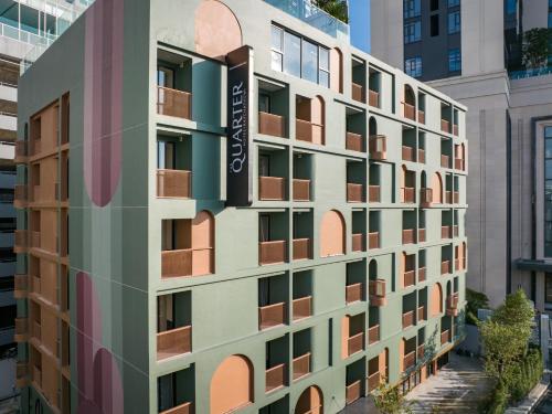 a facade of a building with colorful windows at The Quarter Ratchathewi by UHG in Bangkok