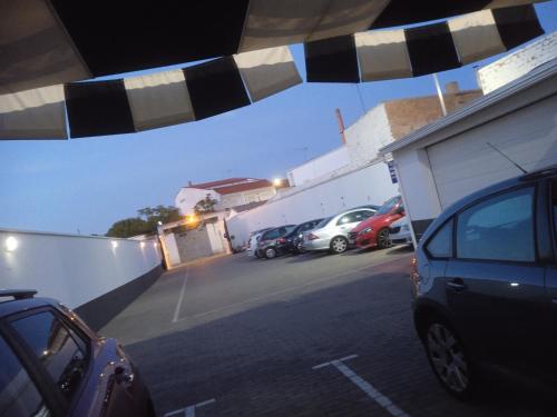 a group of cars parked in a parking lot at Nuñez Tomelloso in Tomelloso