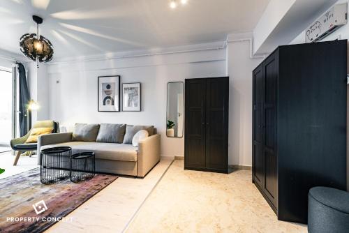 a living room with a couch and a table at Central Residence Apartment 505 in Bucharest
