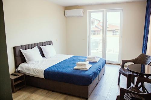 Ένα ή περισσότερα κρεβάτια σε δωμάτιο στο Guesthouse The Rock