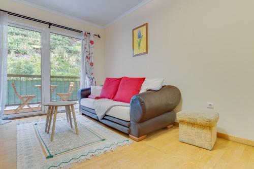 a living room with a couch and a table at Isabel Apartment by Holiday Rental Madeira in Ribeira Brava