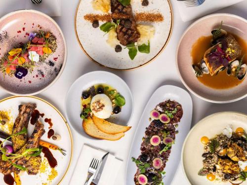 a group of plates of food on a table at Swissotel Sydney in Sydney