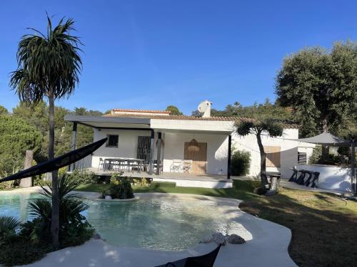 a villa with a swimming pool and a house at Casa teolune in Begur