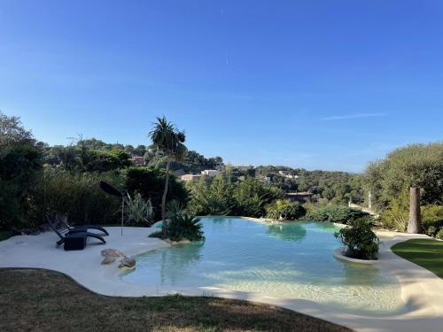 a swimming pool in the middle of a yard at Casa teolune in Begur