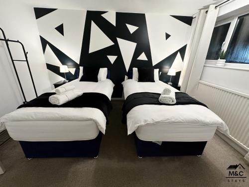 Uma cama ou camas num quarto em Kettering/Stylish/ Perfect for Contractors