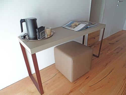 a table with a coffee maker on top of it at Nuovo B&B Colline San Benedetto in Marostica