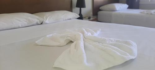 Łóżko lub łóżka w pokoju w obiekcie Pousada Pau Brasil