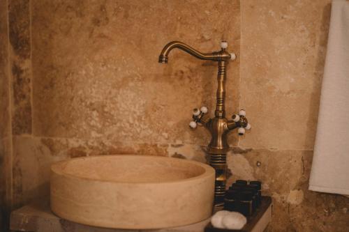 a sink in a bathroom with a faucet at DAPHNE CAVE HOTEL in Avanos