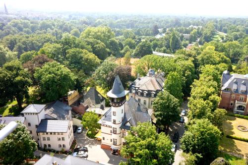 an aerial view of a small town with trees at Hotel Villa Monte Vino in Potsdam