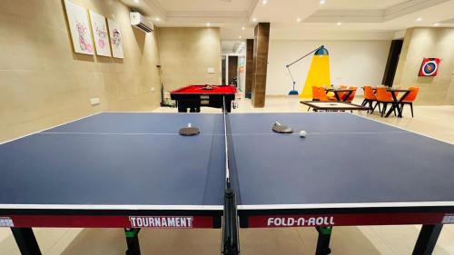 a ping pong table in a room with a ping pong ball at BluO Studio4 DLF Cybercity - Balcony, Gym TT, Lift in Gurgaon