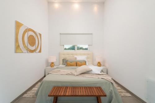 a bedroom with a bed and a table at Casa Blanca in Sencelles
