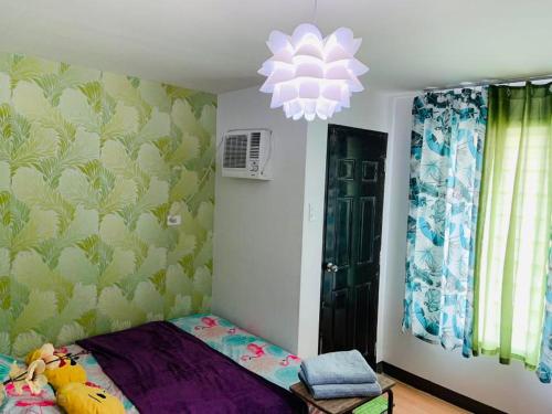 Ein Bett oder Betten in einem Zimmer der Unterkunft Condo staycation in Marilao