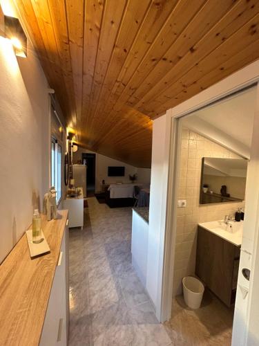 a room with a bathroom with a sink and a mirror at Apartament Villa Luisa in Can Trabal