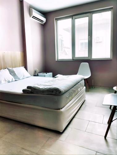 Postel nebo postele na pokoji v ubytování PLEVEN Rooms