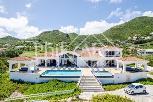an aerial view of a villa with a swimming pool at 10 bed-rooms luxury BEACH VILLA in Guana Bay