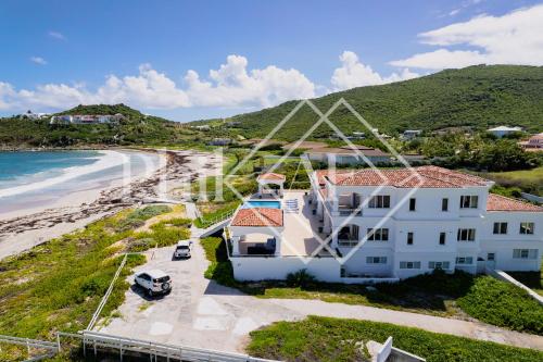 an aerial view of a house on the beach at 10 bed-rooms luxury BEACH VILLA in Guana Bay