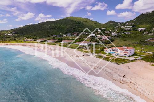 an aerial view of a beach with a roller coaster at 10 bed-rooms luxury BEACH VILLA in Guana Bay
