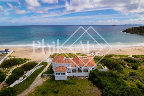 an aerial view of a house on the beach at 10 bed-rooms luxury BEACH VILLA in Guana Bay