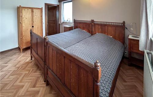 A bed or beds in a room at Gorgeous Apartment In Bastogne With House A Panoramic View
