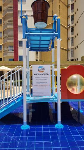a sign for a water slide in a building at Prive das Thermas - 301B in Caldas Novas