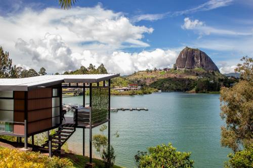 a view of a lake with a mountain in the background at Marina Navegar in Guatapé