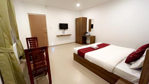 Cama o camas de una habitación en Hotel Dream Suite, Kattappana