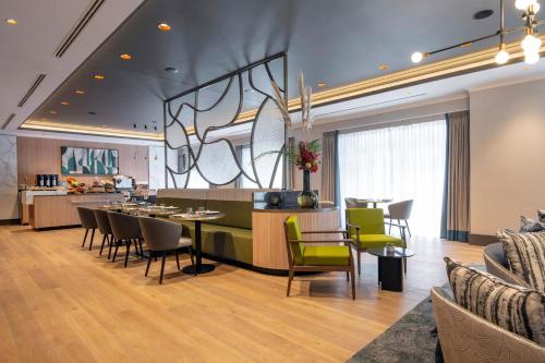 a dining room and kitchen with a table and chairs at Brussels Marriott Hotel Grand Place in Brussels