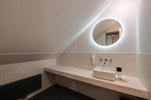 a bathroom with a sink and a mirror at BURSA Hotel Kyiv in Kyiv
