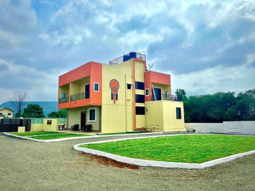 a building with a painting of a head on it at 5bhk- Nature Villa in Lonavala