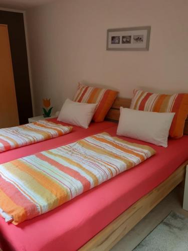 two beds sitting next to each other in a room at Ruhepol in Villingen-Schwenningen