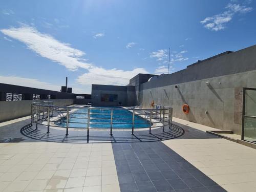 a swimming pool on top of a building at Studio in Dubai