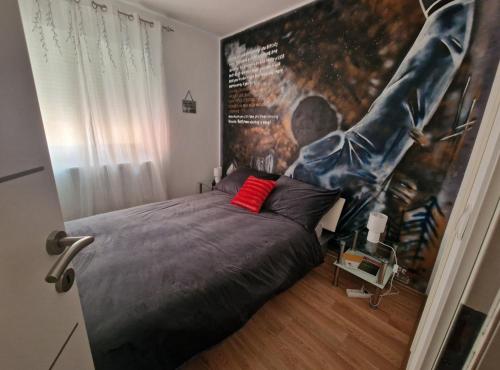a bedroom with a large poster of a football player at Apartman Samantha in Vinkovci