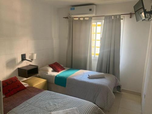 Llit o llits en una habitació de Hostal Camp de Mar