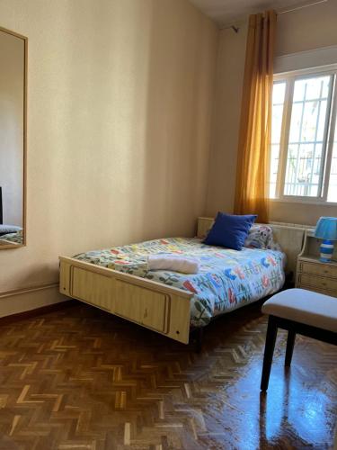 Un pat sau paturi într-o cameră la Apartamento Oporto