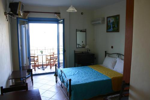 Postel nebo postele na pokoji v ubytování Porto Ageranos Apartment