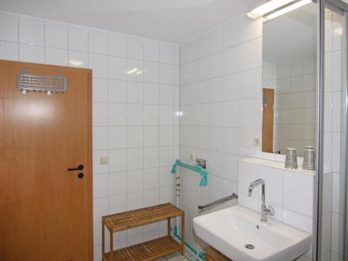a bathroom with a sink and a mirror at Apartment Raum in Fehmarn Orth in Orth