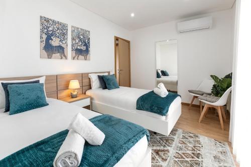 En eller flere senge i et værelse på Zahra Place - Stylish Flat