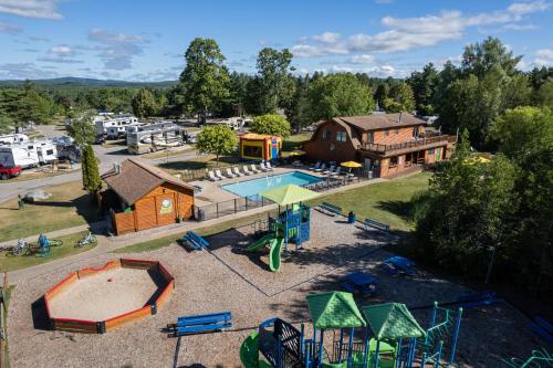 an aerial view of a park with a playground at Jellystone Park TM Petoskey in Petoskey