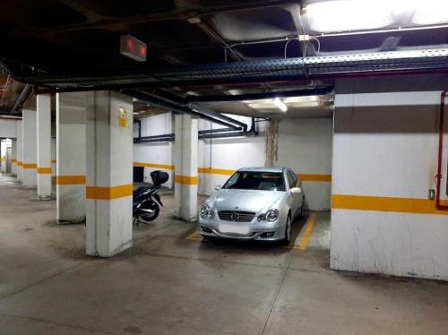 a car is parked in a parking garage at Santo António Guest Apartment in Funchal
