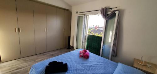 Ένα ή περισσότερα κρεβάτια σε δωμάτιο στο Villa Monni