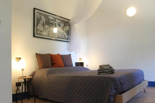 a bedroom with a bed with orange pillows at Radius Horse Ranch B&B in Massa Martana