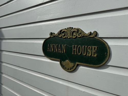 a sign that says aman house on the side of a house at Antrim 1844 in Taneytown